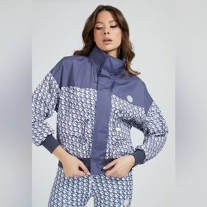 Womens GUESS Clare Logomania Windbreaker Jacket
Size: Large 
Retail new for $108